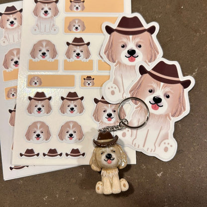 Dog stickers and keychain with cowboy hats on a brown background